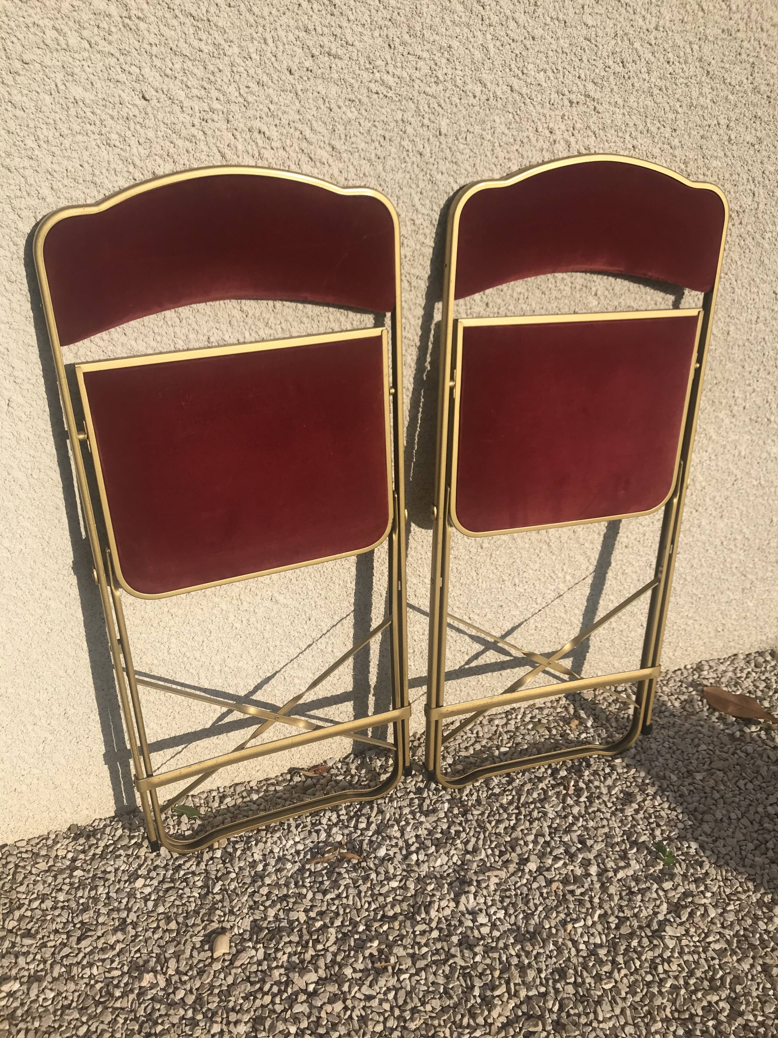 Pair of foldable red velvet chairs