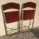 Pair of foldable red velvet chairs
