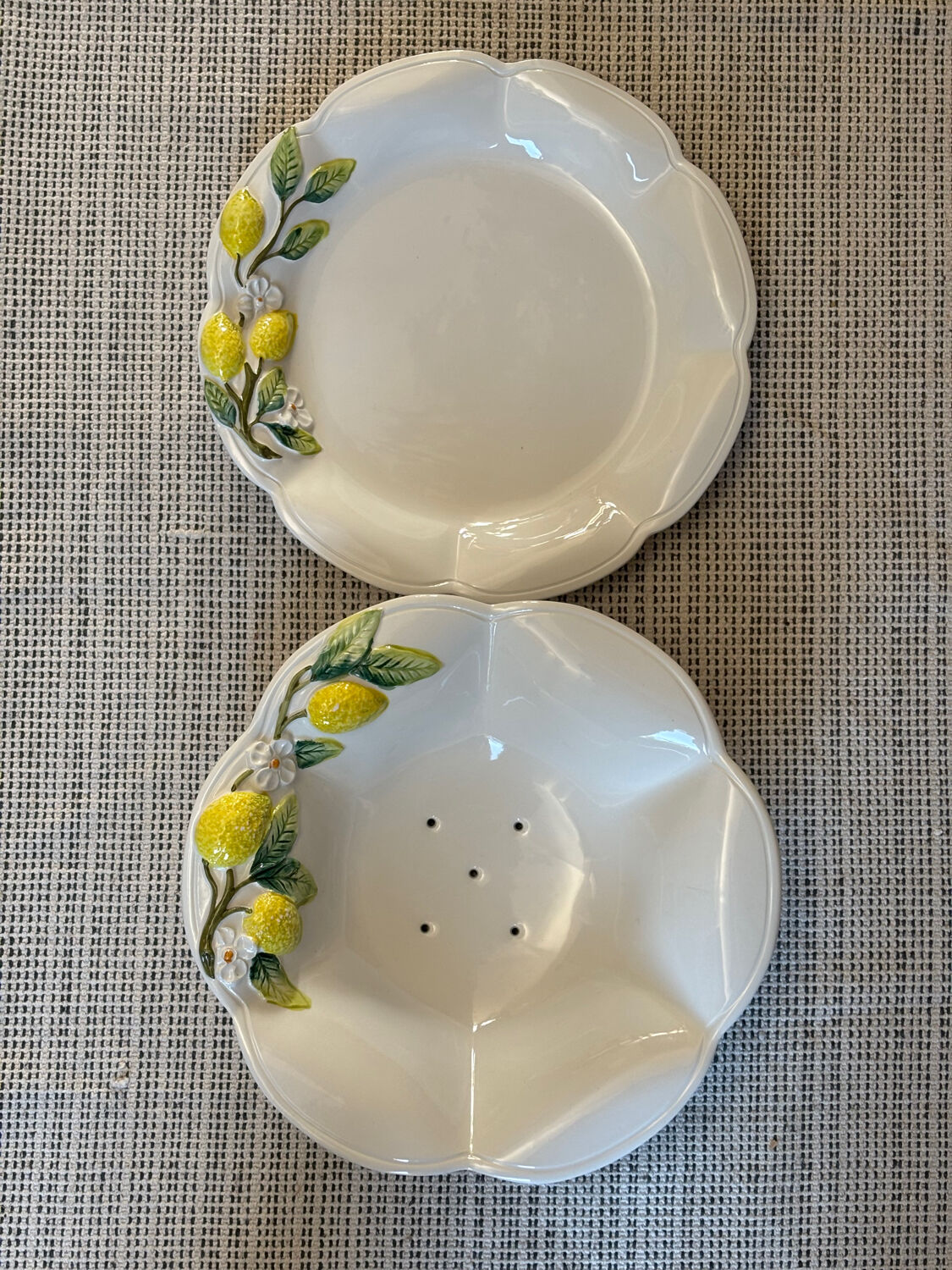 Plate and colander of lemons in slipware