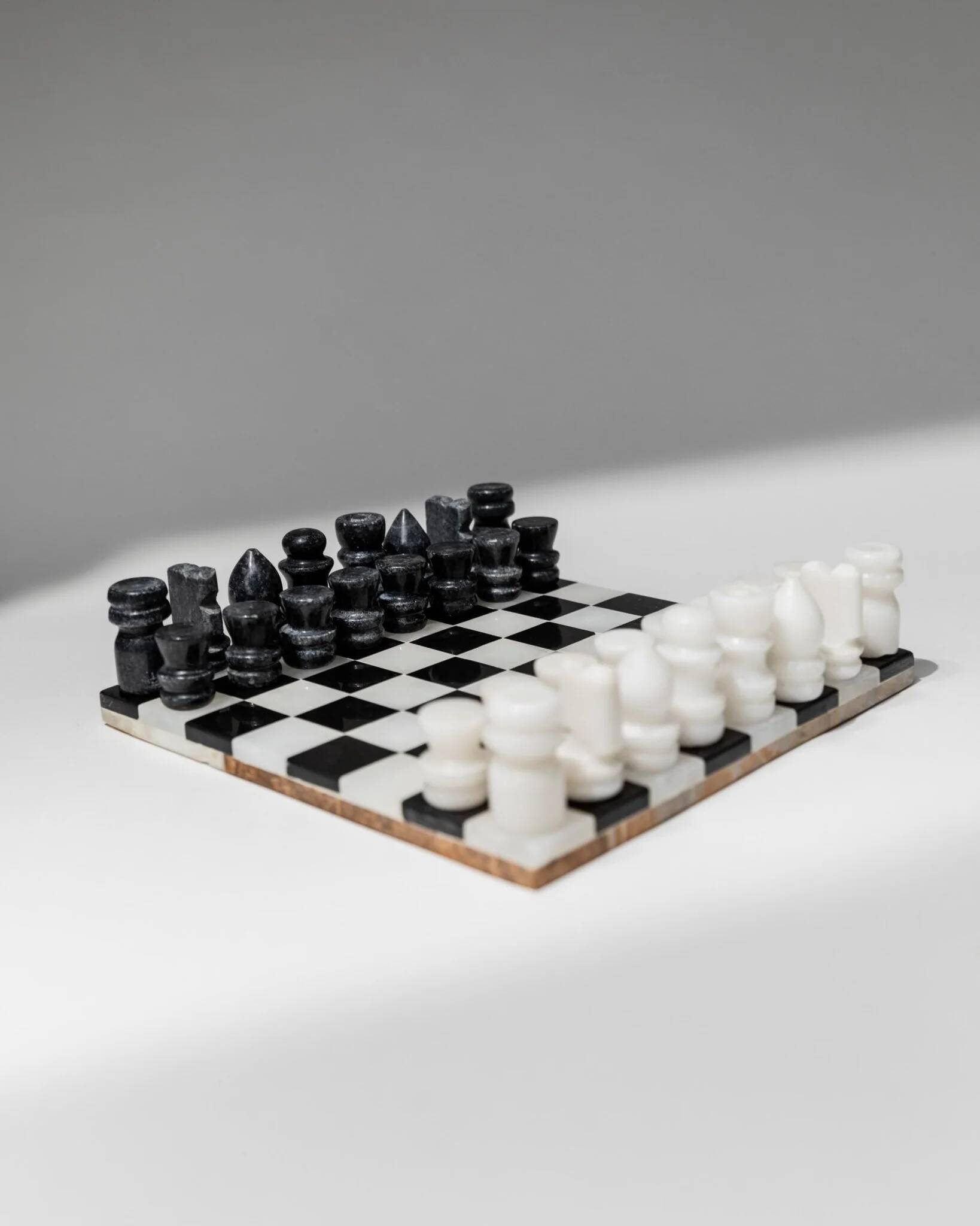 Vintage black-and-white marble chessboard with matching marble pieces, Italian 1960s design, sculptural centerpiece