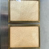 Pair of gold colored  metal art deco picture frames