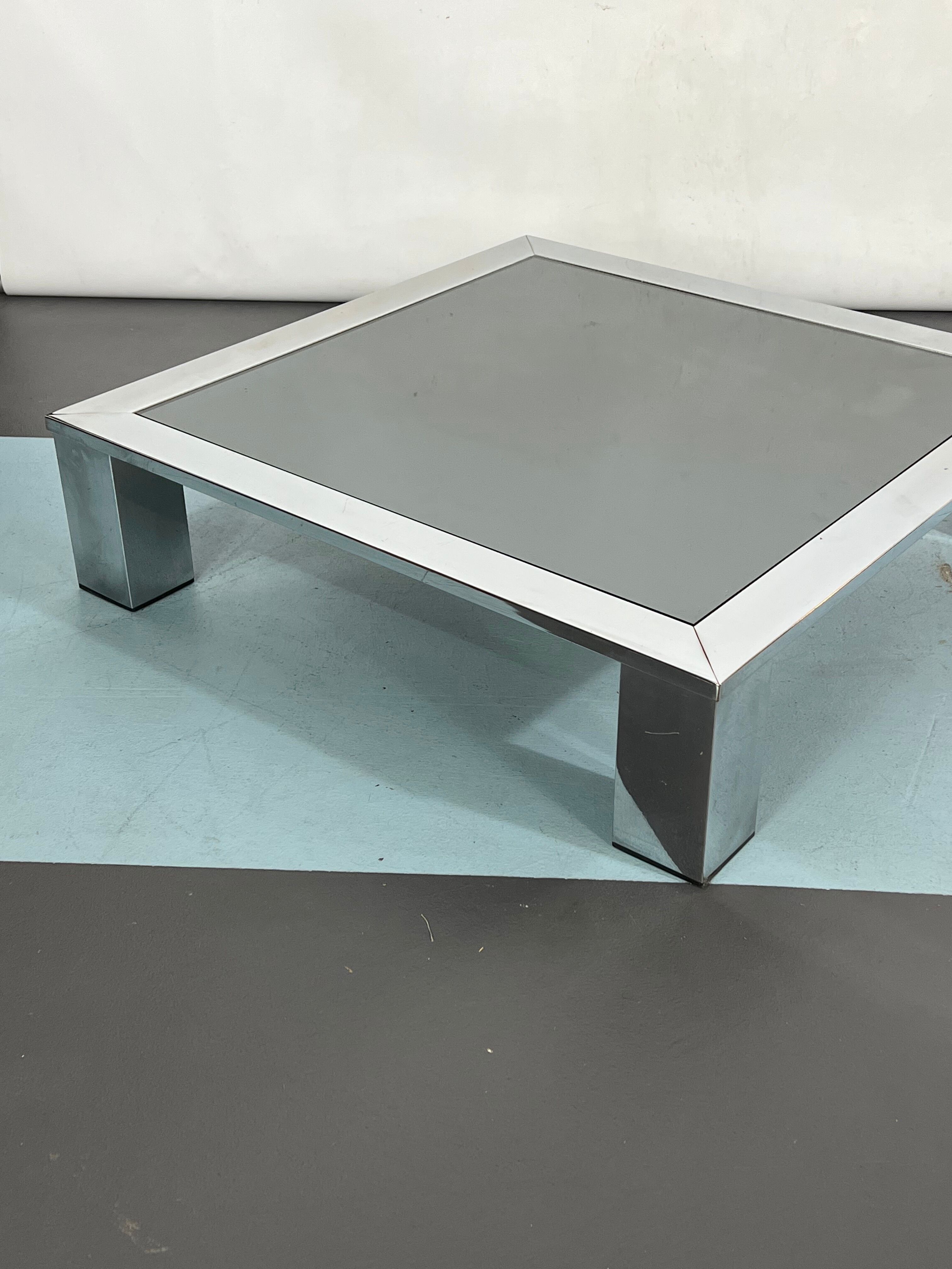 Mid-century chrome and dark mirror glass side table attributed to Saporiti. Italy 1970s