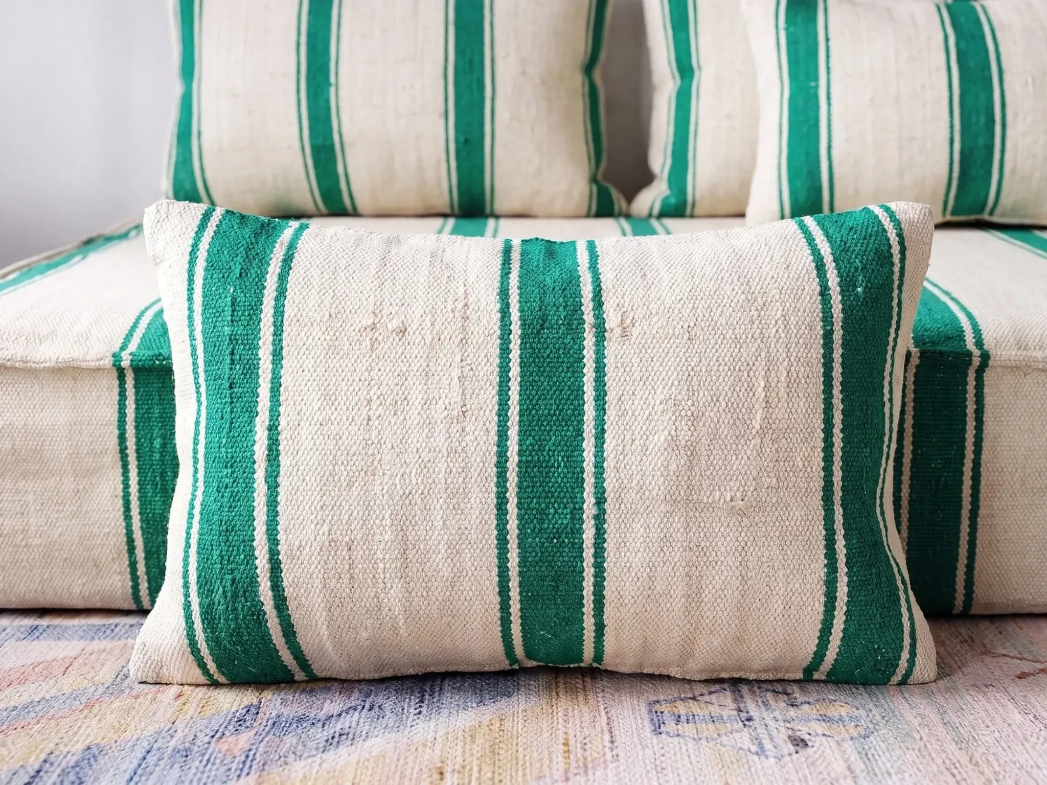 Emerald striped Moroccan living room set with pouf.