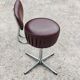 Set of 4 Mid Century Modern swivel chairs in tubular steel and leather.