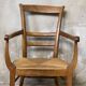 Louis Philippe armchair in walnut and straw, 19th century.