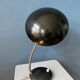 Small black metal desk lamp in Bauhaus style.