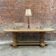 Massive oval monastery table in bleached oak with turned legs.