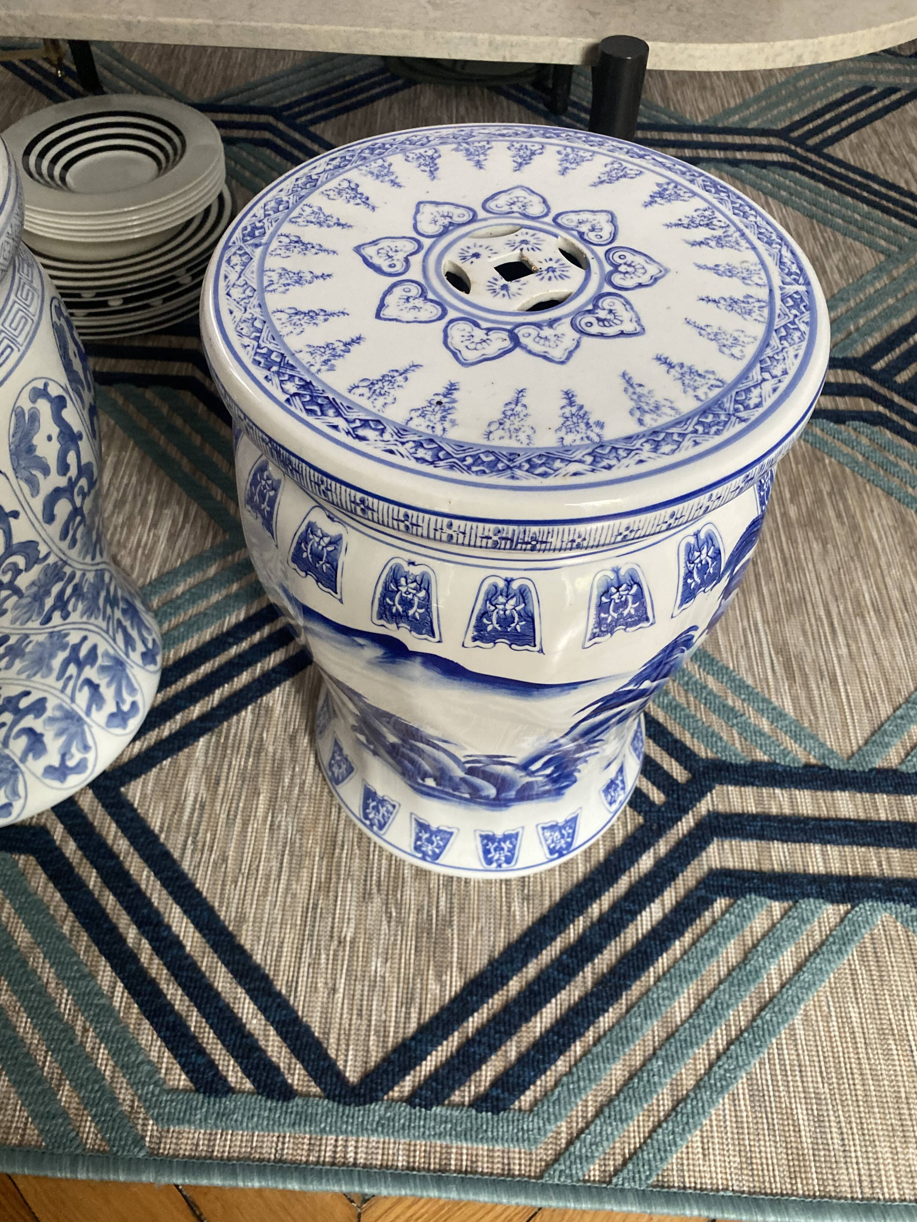Set of two white and blue porcelain side tables.