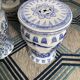 Set of two white and blue porcelain side tables.