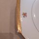 Hexagonal plate Lamotte with a double gold border, decorated with small bouquets.