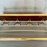 Vintage coat rack with 1970s repai décor