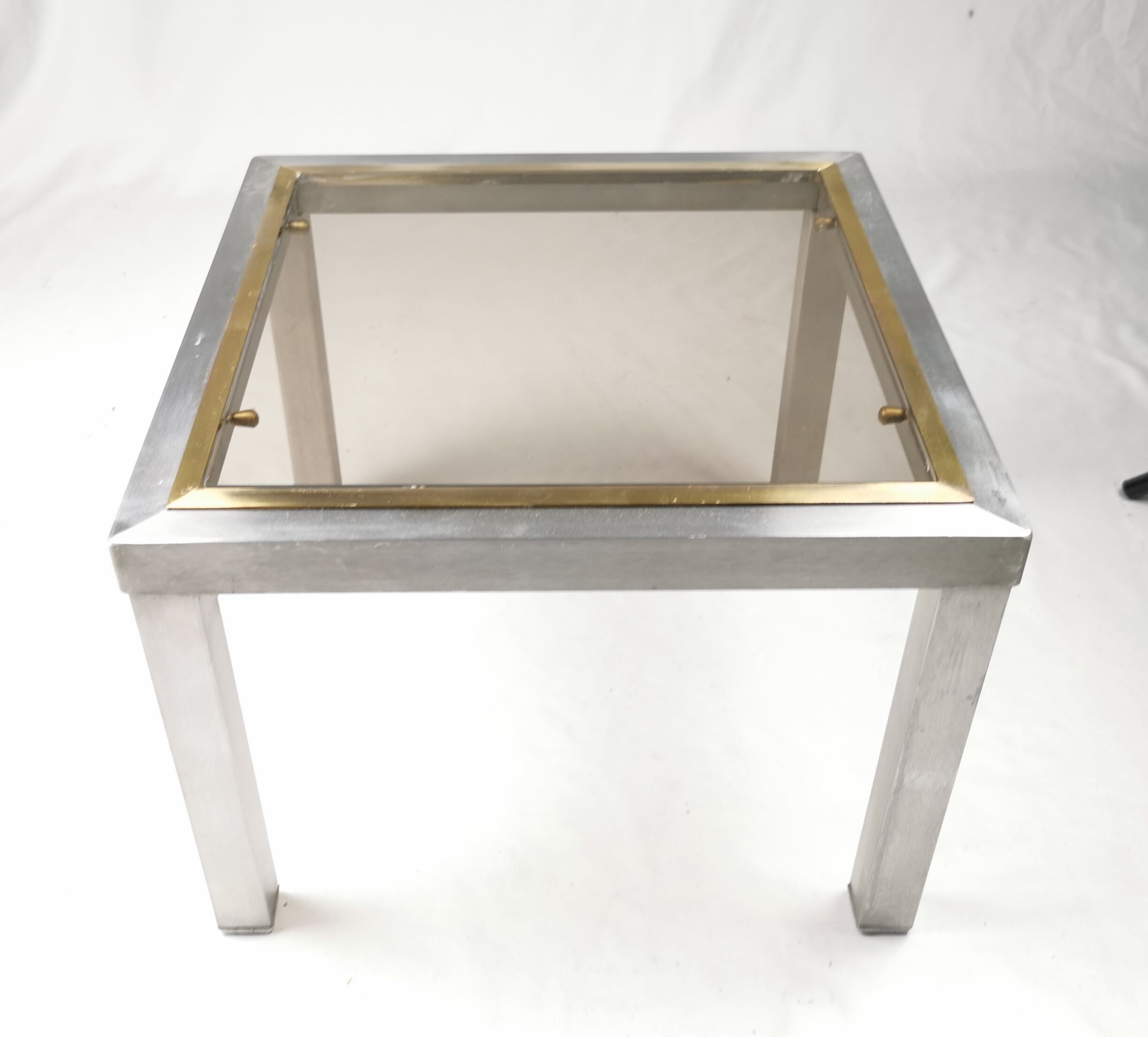 Suite of 5 coffee tables in chrome metal, brass, smoked glass. around 1970