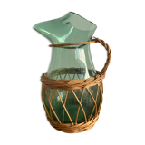 Glass pitcher and wicker