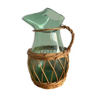 Glass pitcher and wicker