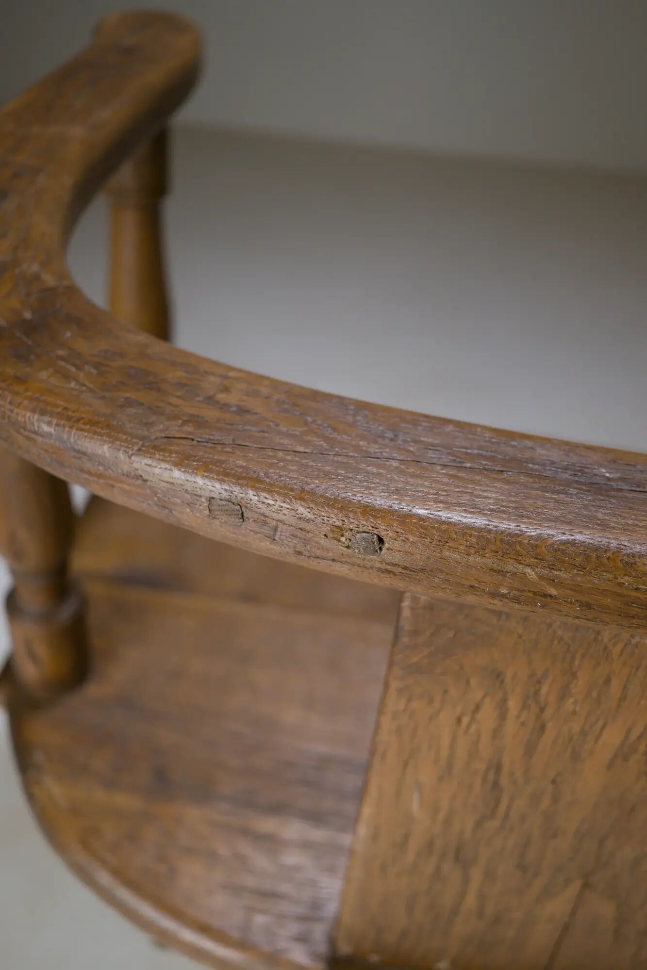 Swivel armchair in carved oak with ball bearings, early 20th century.