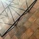 Design coffee table in glass and black metal – Geometric base