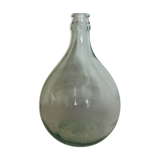 Demijohn in glass with light blue reflection