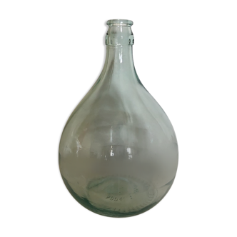 Demijohn in glass with light blue reflection
