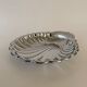 Large silver-plated serving dish in the shape of a vintage shell.