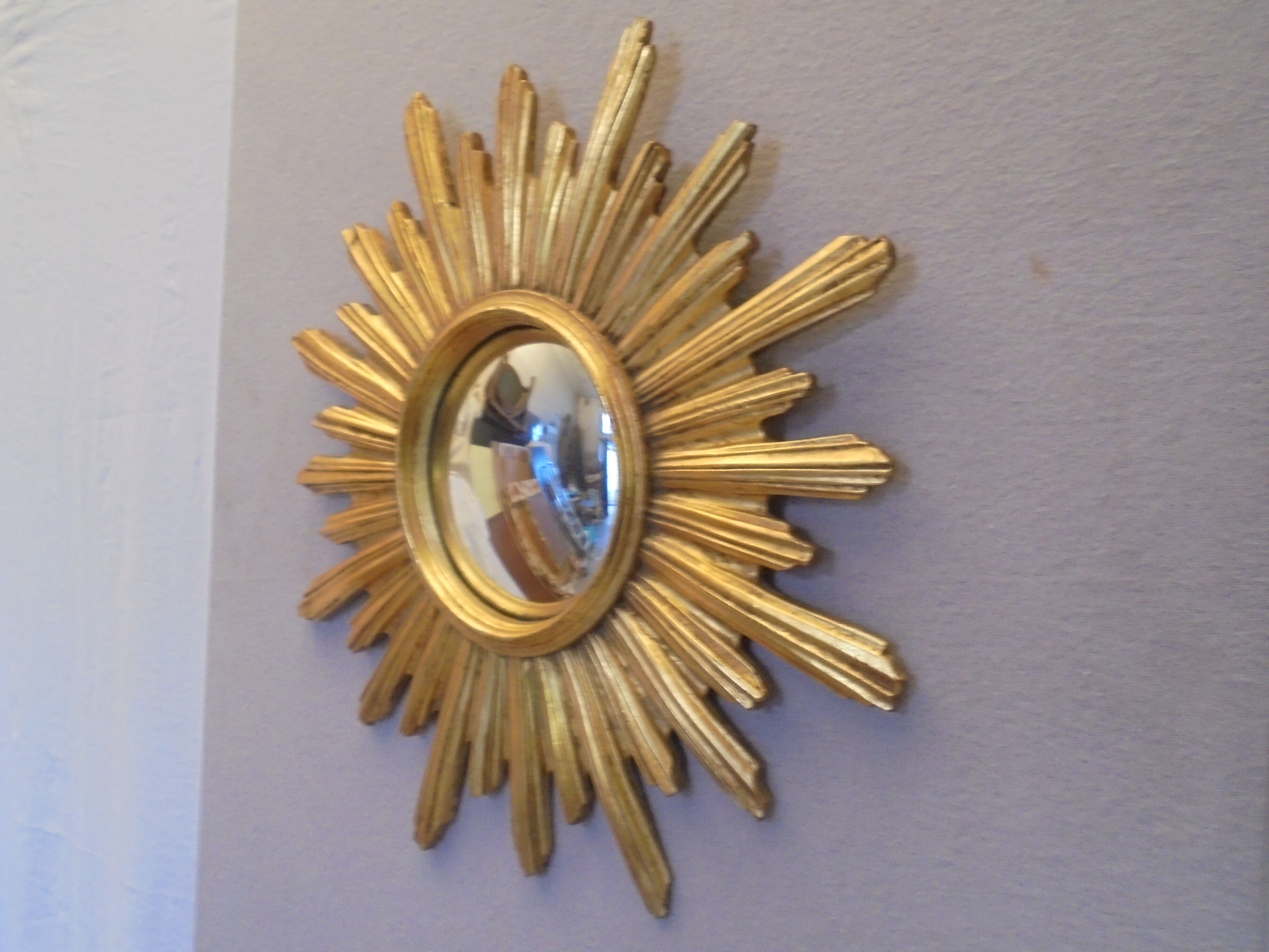 Sun mirror in golden resin from the 70s