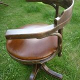 Swivel leather armchair