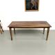 Farm table in walnut with spindle legs.
