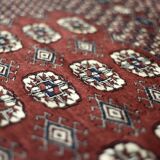 Handwoven red Boukhara oriental rug, 1960s