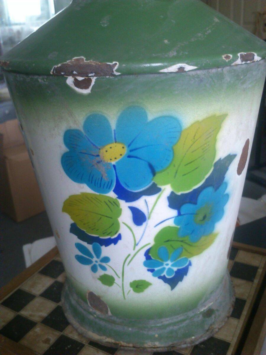 Vintage 1950s green enamelled metal water jug with retro floral decoration.