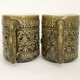 Duo of BP 70's slip mugs