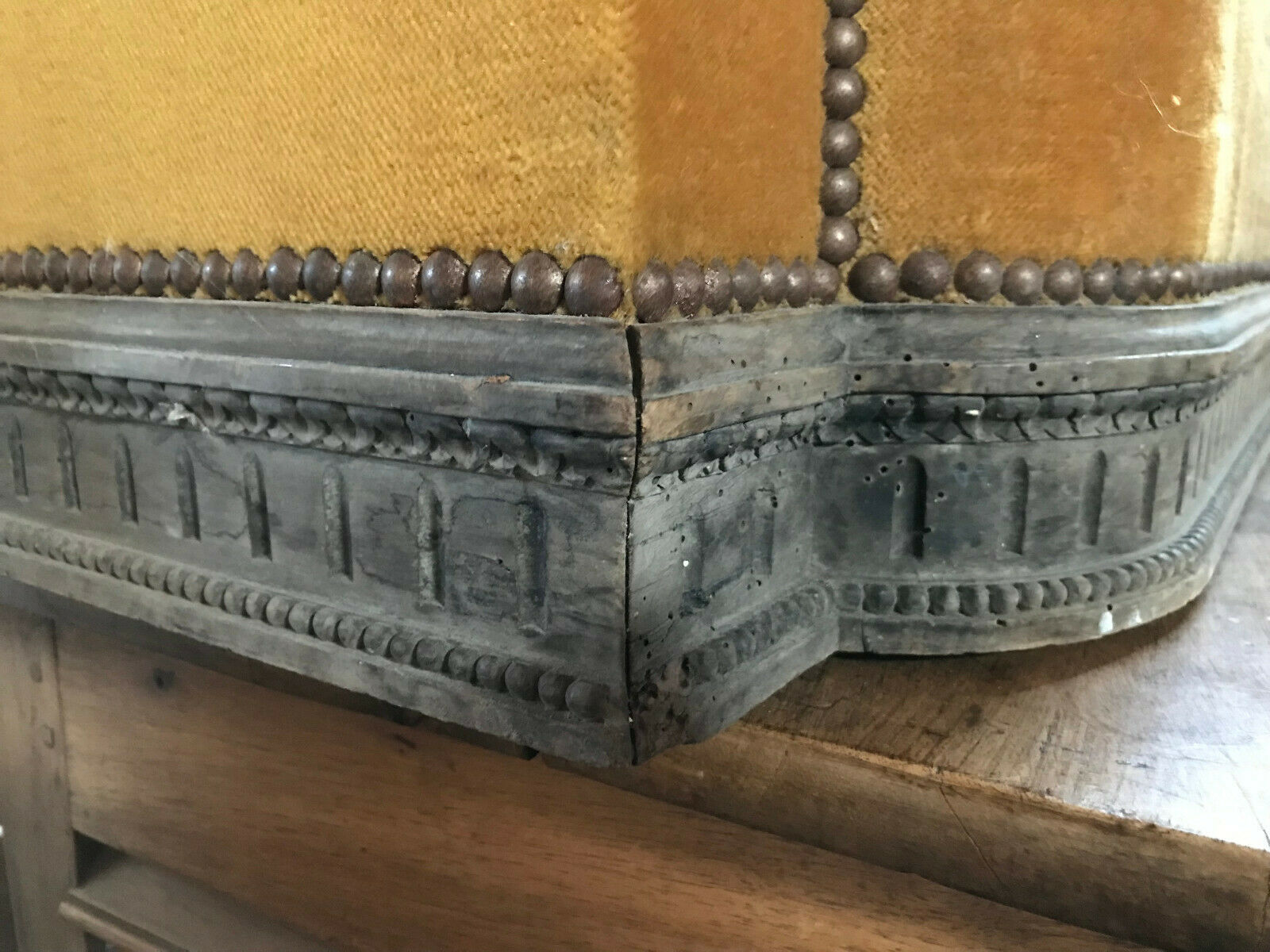 Old wooden chest and yellow velvet