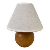 Wooden ball bedside lamp and beige lampshade