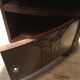 Solid oak bedside table with brown and white marble.