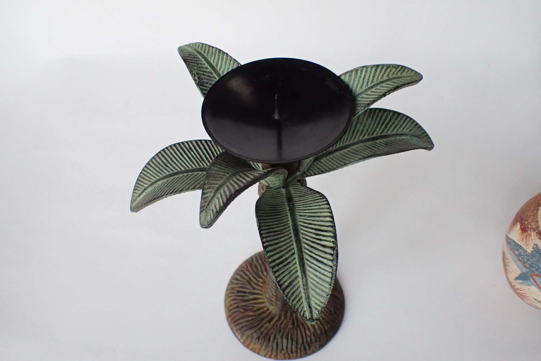 Antique palm tree-shaped candlestick in patinated metal
