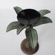 Antique palm tree-shaped candlestick in patinated metal