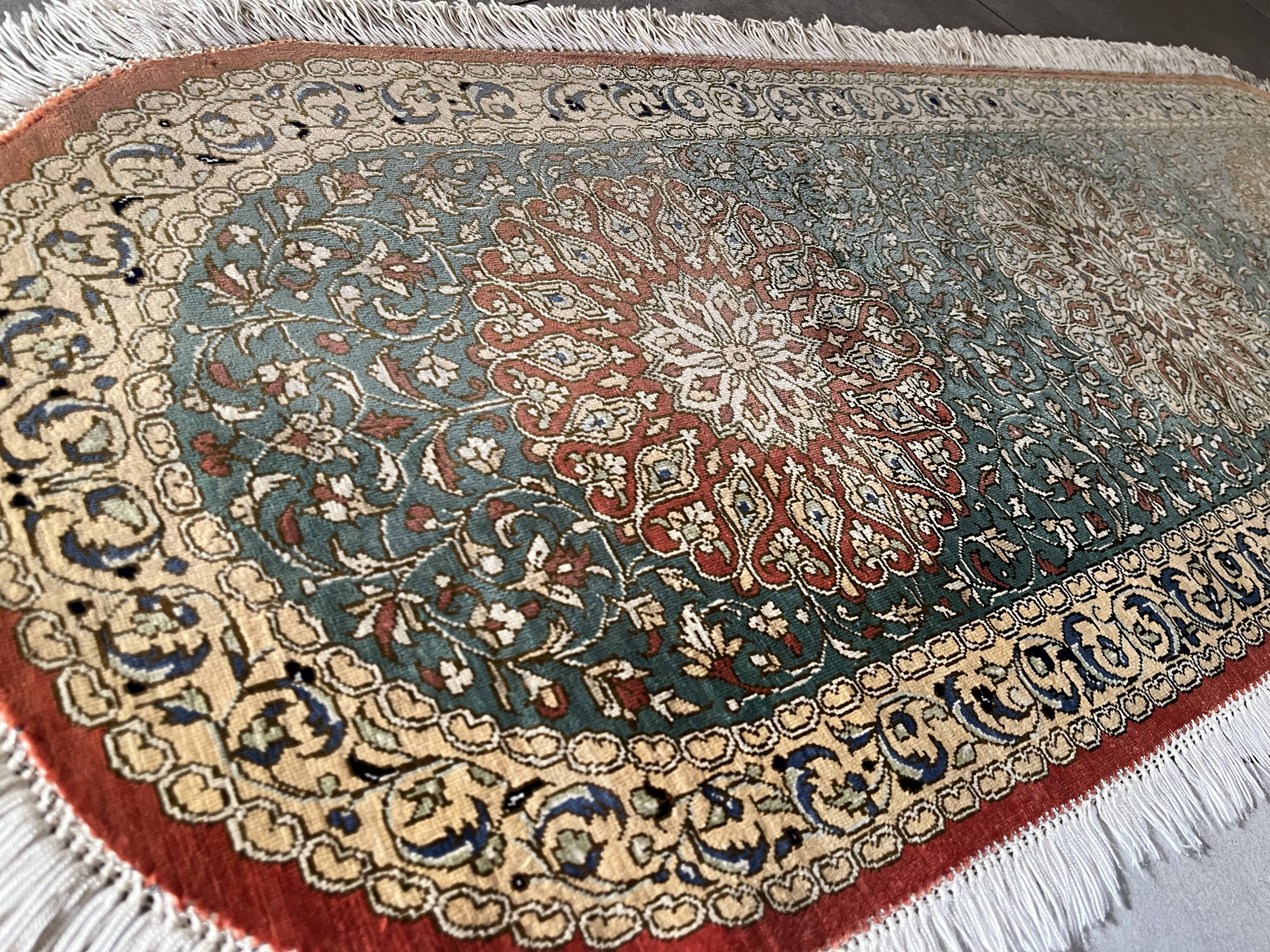 Sino Hereke oval silk rug
