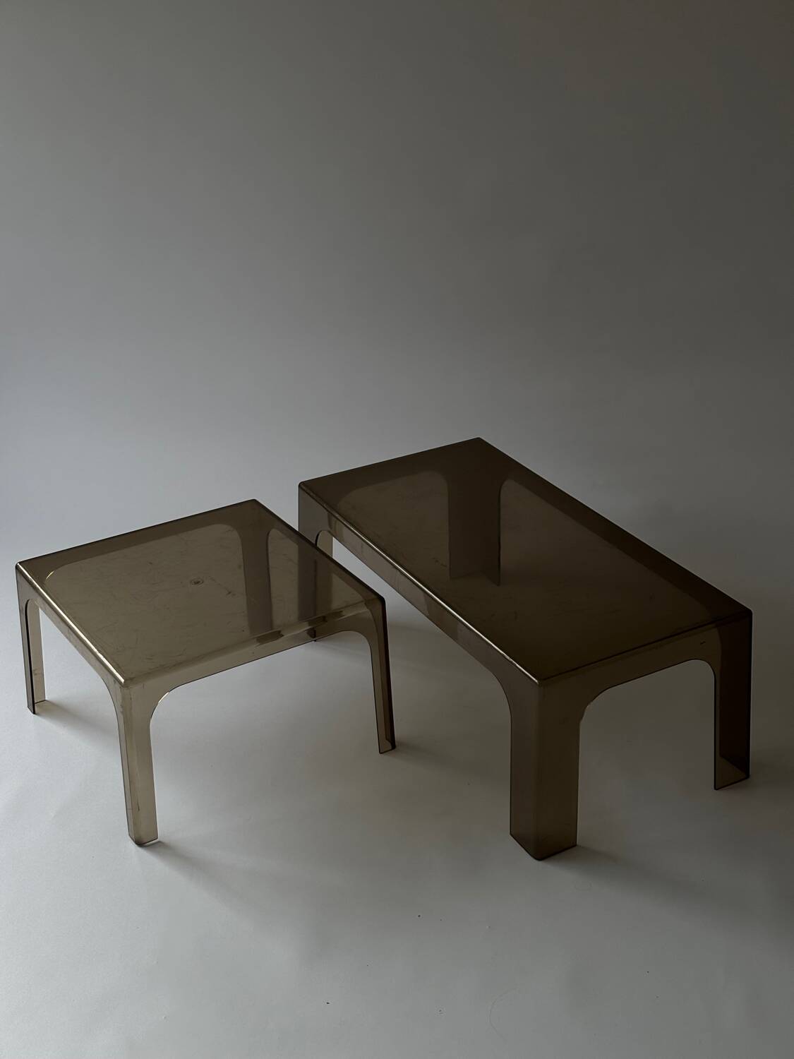 Smoked plastic coffee tables 1970