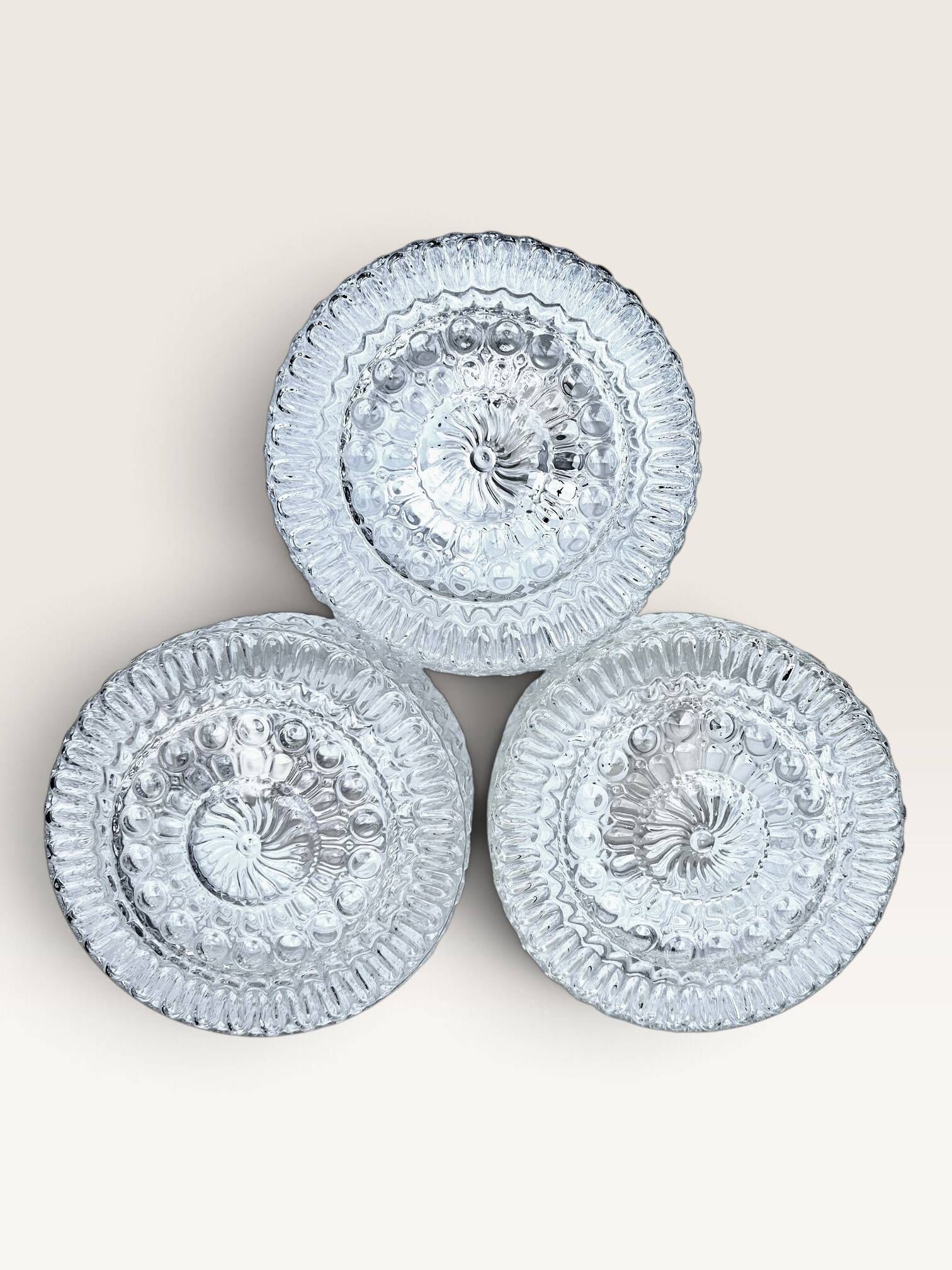 Set of three round wall/ceiling lights in moulded glass.