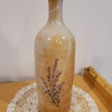 Bouteille fleurie en grès émaillé