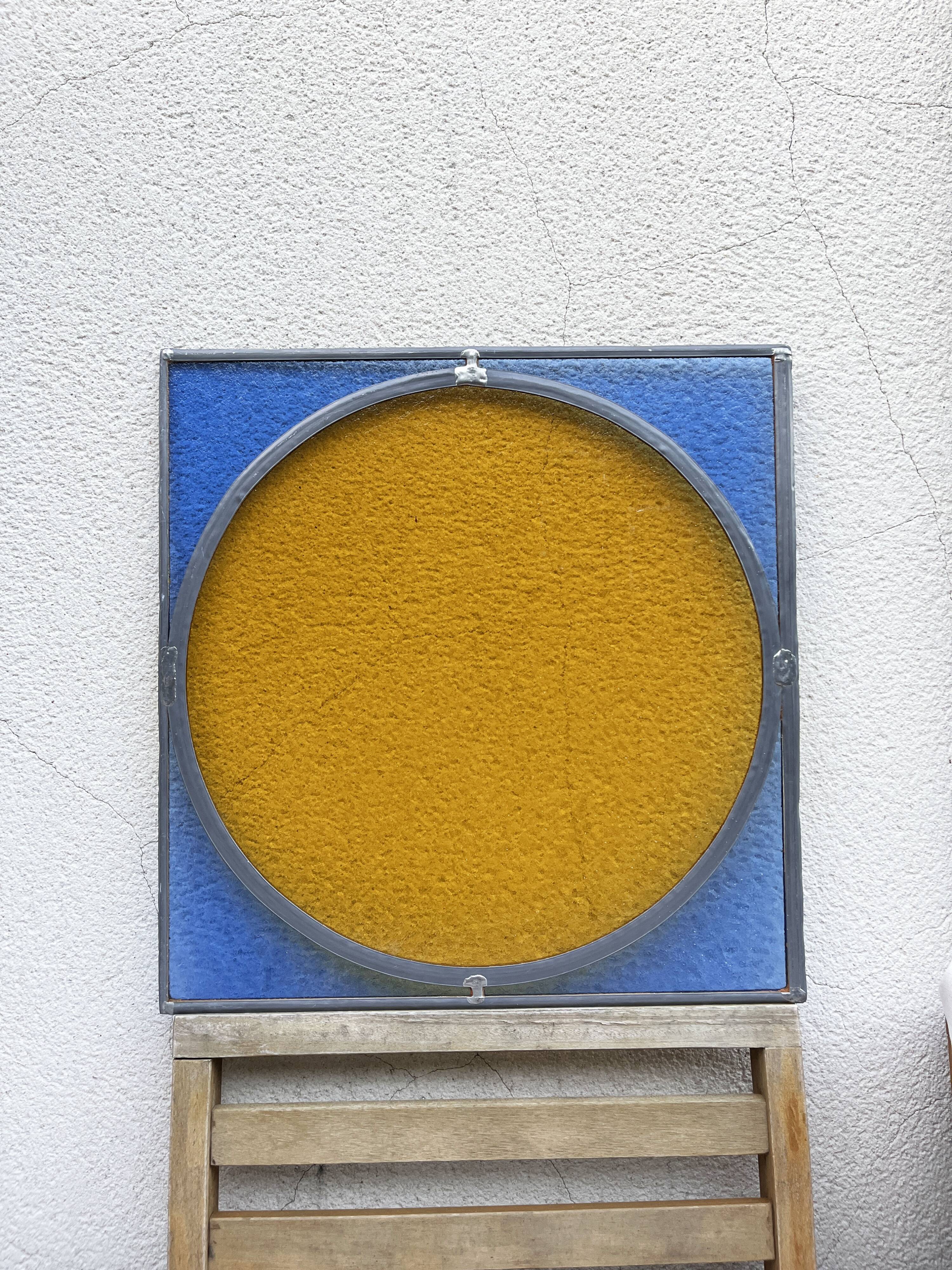 Pair of antique blue and yellow stained glass windows