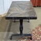 Coffee table in wrought iron with a slate top, work from the 1950s.