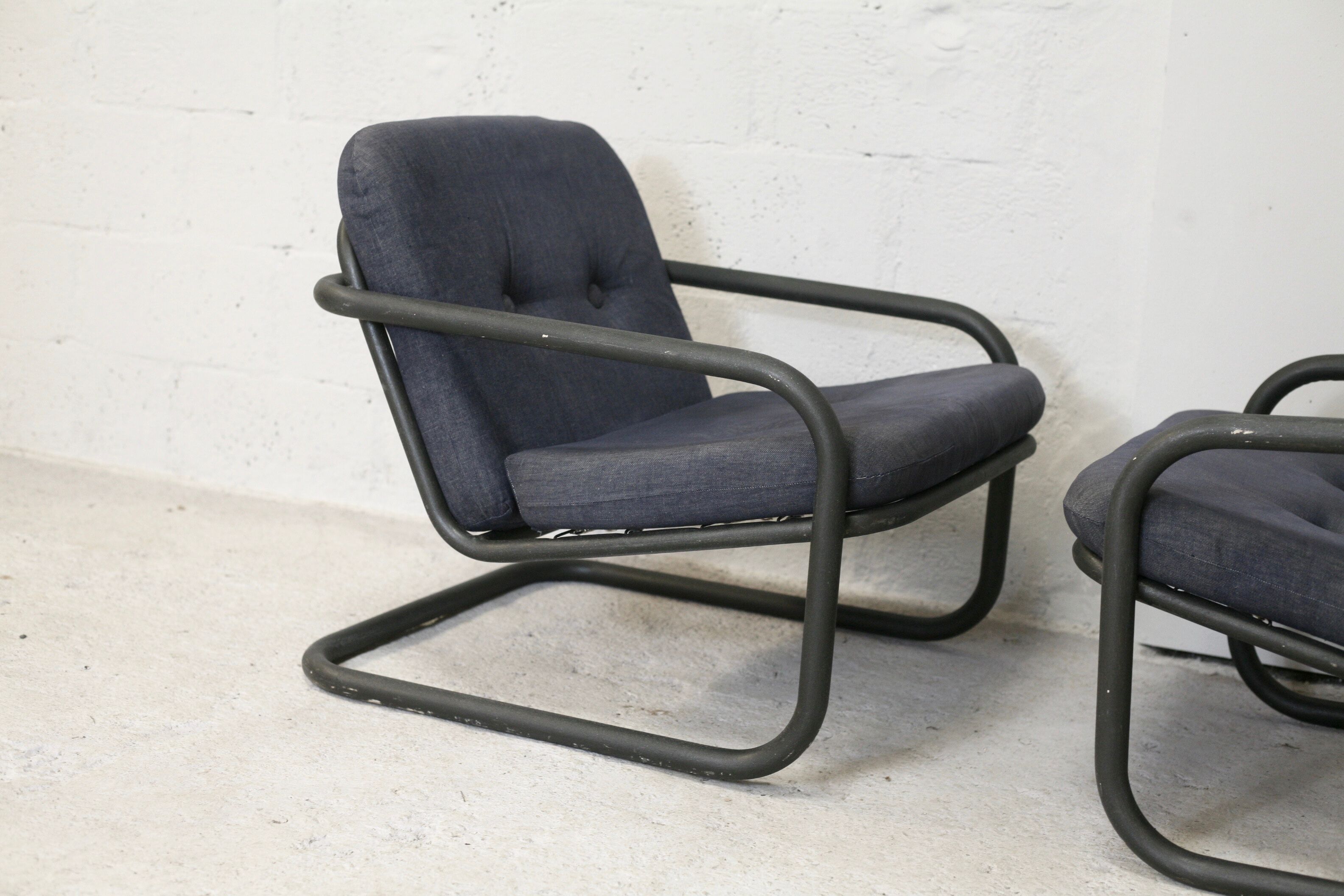 Pair of Prisunic edition armchairs, tubular steel and foam cushions, France, 1973