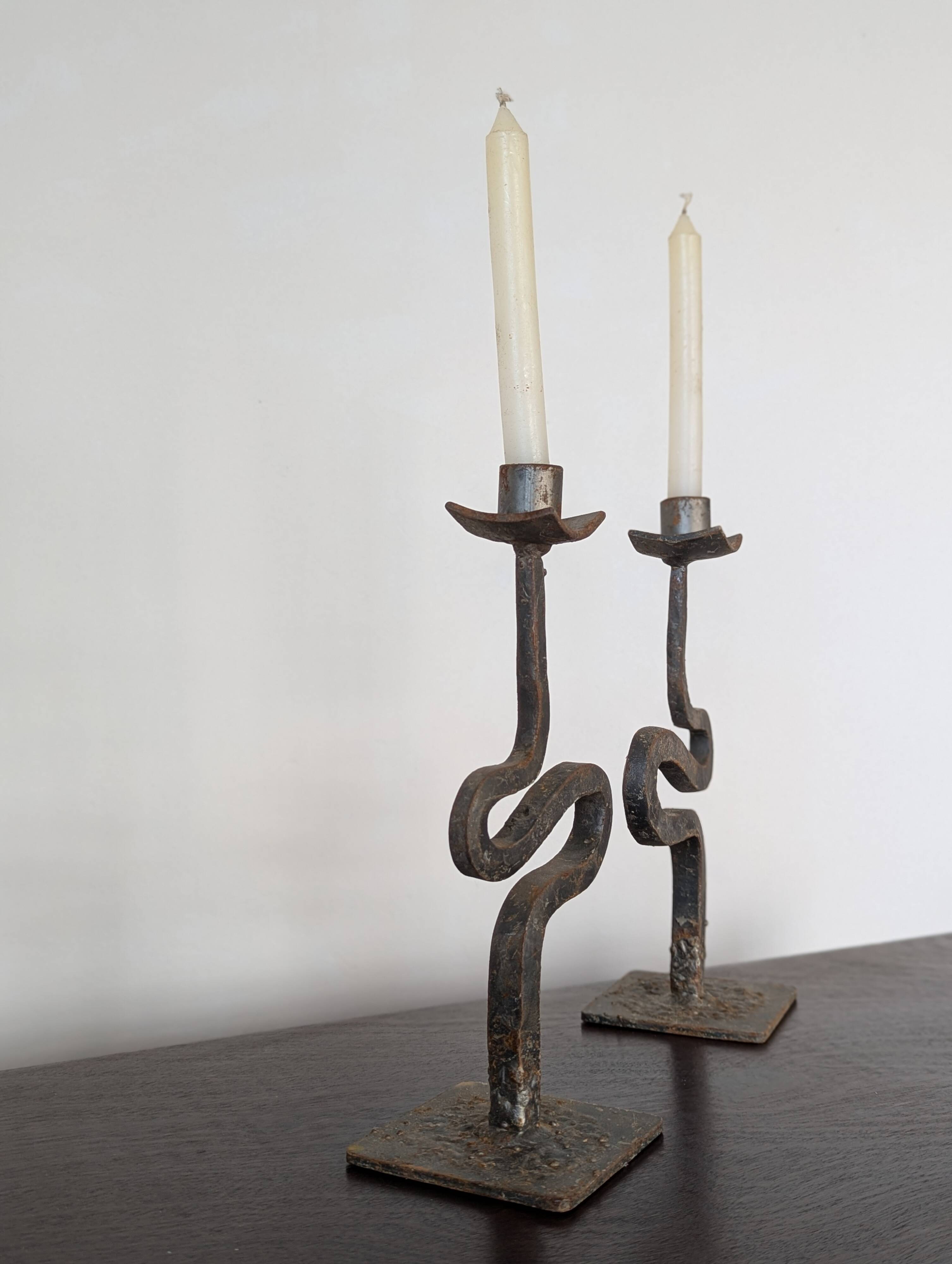 Pair of wrought iron candlesticks
