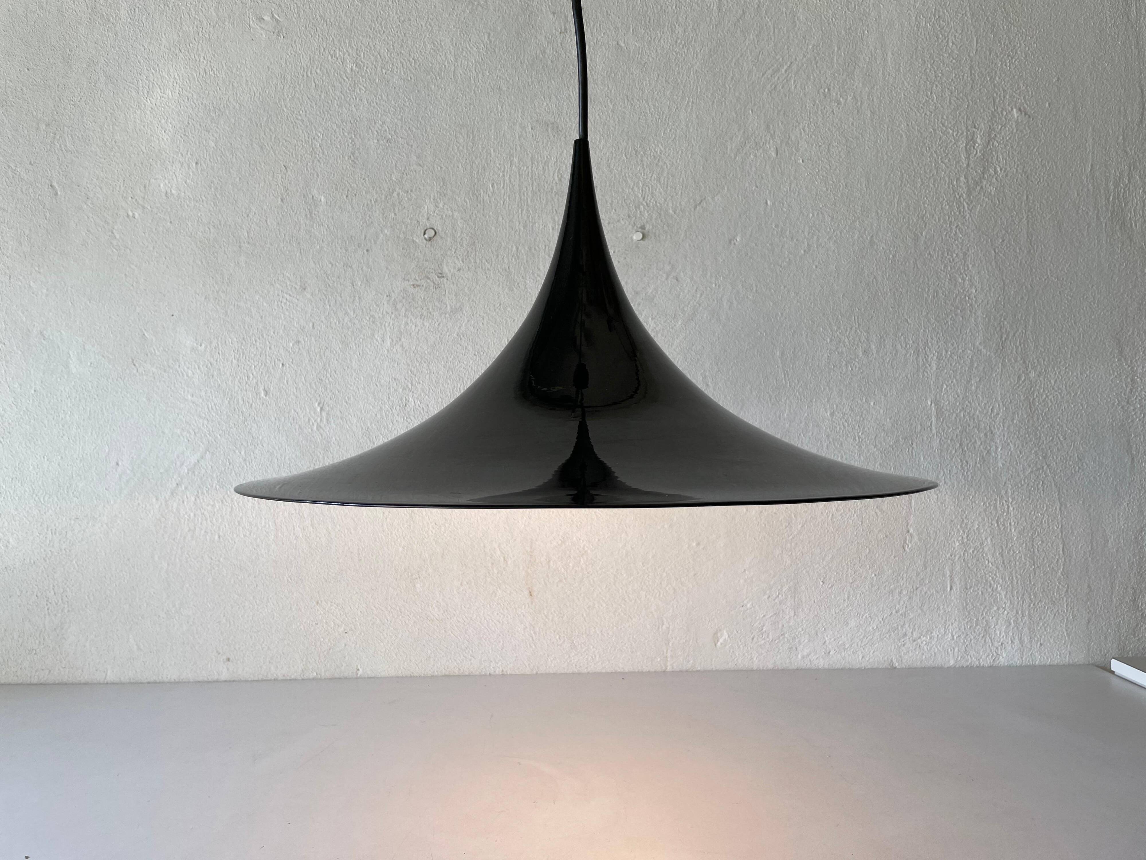 Black metal pendant lamp with trumpet design, 1960s, Italy.