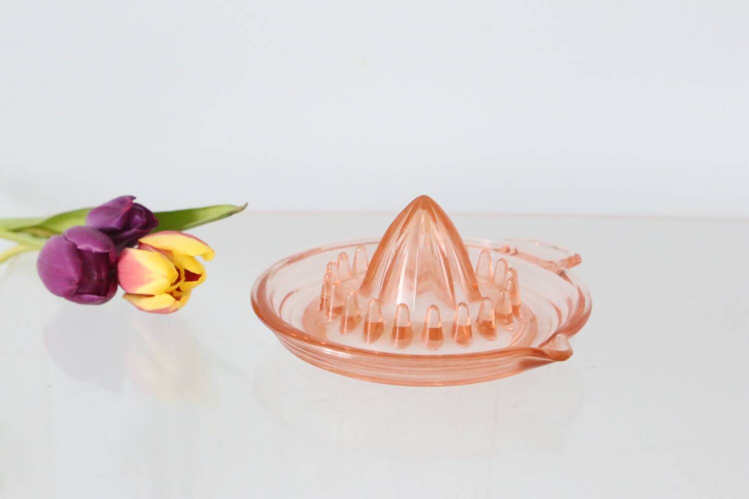 Adorable pink glass juicer