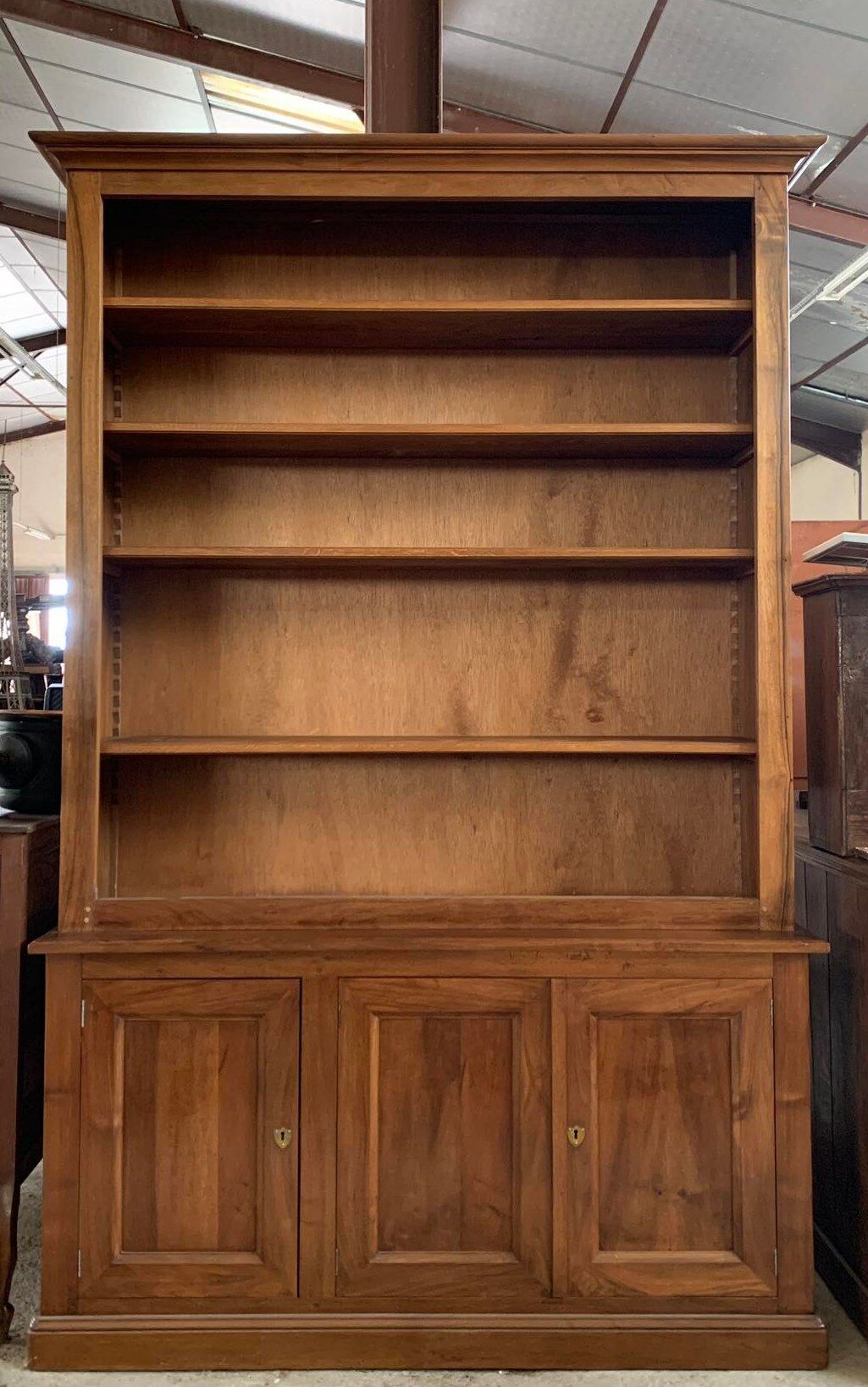 Bibus bookcase of walnut parquet with blonde patina