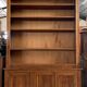 Bibus bookcase of walnut parquet with blonde patina