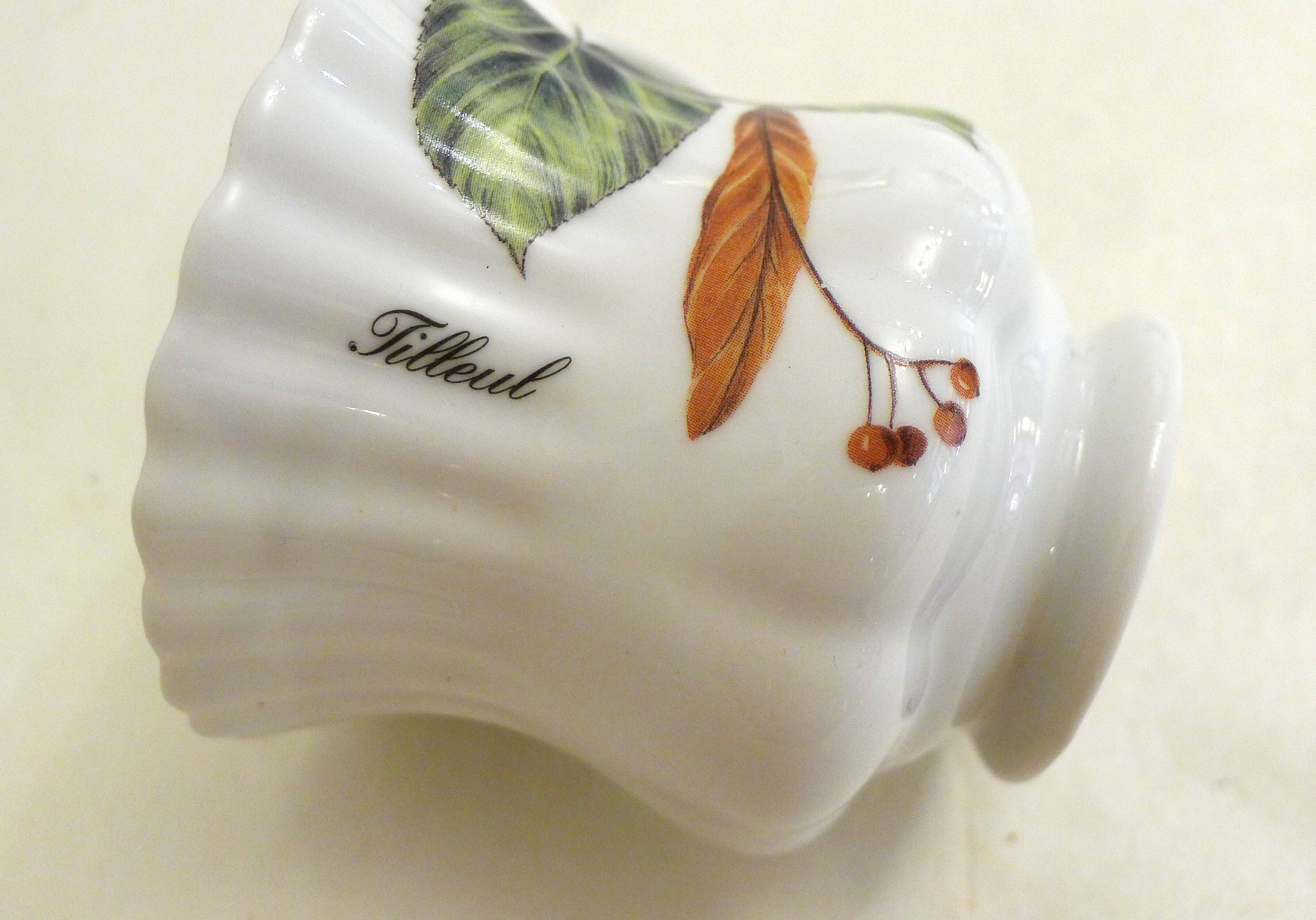 Tea cup, solitary service, naturalistic decoration, in Limoges porcelain.
