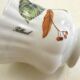 Tea cup, solitary service, naturalistic decoration, in Limoges porcelain.