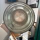 Silver metal champagne bucket.