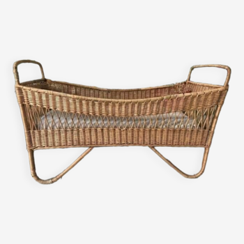 Vintage baby bed in rattan and wicker, old cradle furniture